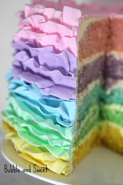 aaa slice rainbow pastel ruffle cake